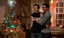 Jim Parsons and Ben Aldridge stand near a Christmas tree in a film still from the movie "Spoiler Alert."