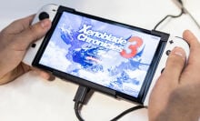Nintendo Switch console playing Xenoblade Chronicles 3