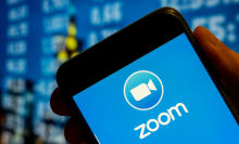  The Zoom logo displayed on a smartphone screen.