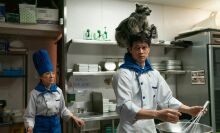 A still from the film 'Everything Everywhere All at Once', with Michelle Yeoh and Harry Shum Jr. in a kitchen.