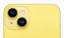 A closeup of the top of the new yellow iPhone.