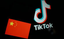 In this photo illustration flag of China seen displayed on a smartphone screen with a TikTok logo in the background in Athens, Greece on March 9, 2023. 