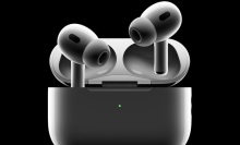dramatically shaded airpods pro buds and their case on a black background