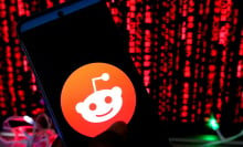 The Reddit logo on a phone
