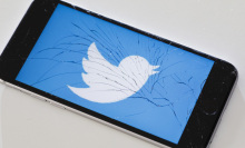 Twitter logo on broken iPhone screen