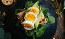 Boiled eggs and avocado on toast and spinach