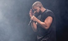 rapper drake holding his head on stage