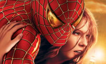 Spider-Man 2 poster showing Mary Jane clinging to Spider-Man. The reflection of Doc Ock can be seen in the eye lens of Spider-Man's costume.