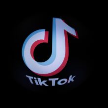This photograph taken with a fish-eye lens in Paris on March 1, 2023 shows the social media application logo TikTok. - The European Parliament has told staff on March 1, 2023 to purge TikTok from devices used for work because of data protection concerns, after similar moves by the EU's main governing bodies last week.