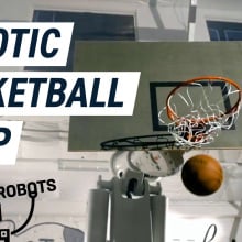 A basketball hoop mounted on an industrial robotic arm