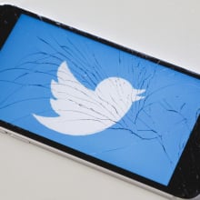 Twitter logo on broken iPhone screen