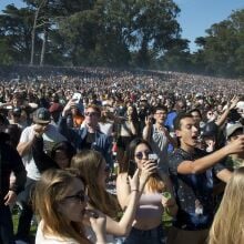 Thousands of people stand and take selfies at 4:20pm at the first sponsored 420 event in Golden Gate Park in San Francisco on April 20, 2017.
