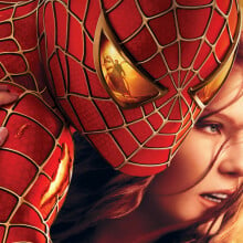 Spider-Man 2 poster showing Mary Jane clinging to Spider-Man. The reflection of Doc Ock can be seen in the eye lens of Spider-Man's costume.