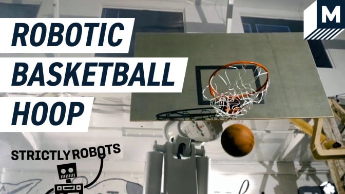 A basketball hoop mounted on an industrial robotic arm
