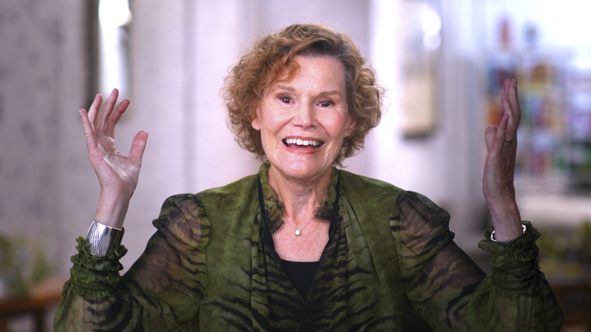 Judy Blume in a green blouse.