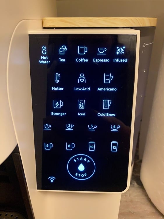 LED panel on coffee maker with options like hot water, espresso, hotter, stronger, and iced