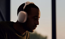 Man with Apple AirPods Max at dusk