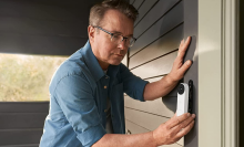 Man installing a Google nest security doorbell 