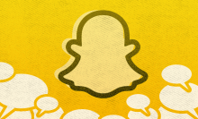 The Snapchat logo on a gold background surrounded by chat bubbles. 