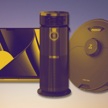 macbook, roborock vacuum, and shark fan with purple and yellow tint and background