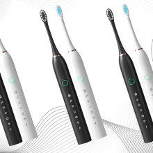 Two-pack of electric toothbrushes on background with white design