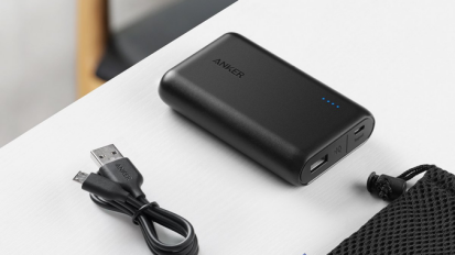 Anker portable charger on a white table.