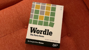 Wordle board game box on a red background
